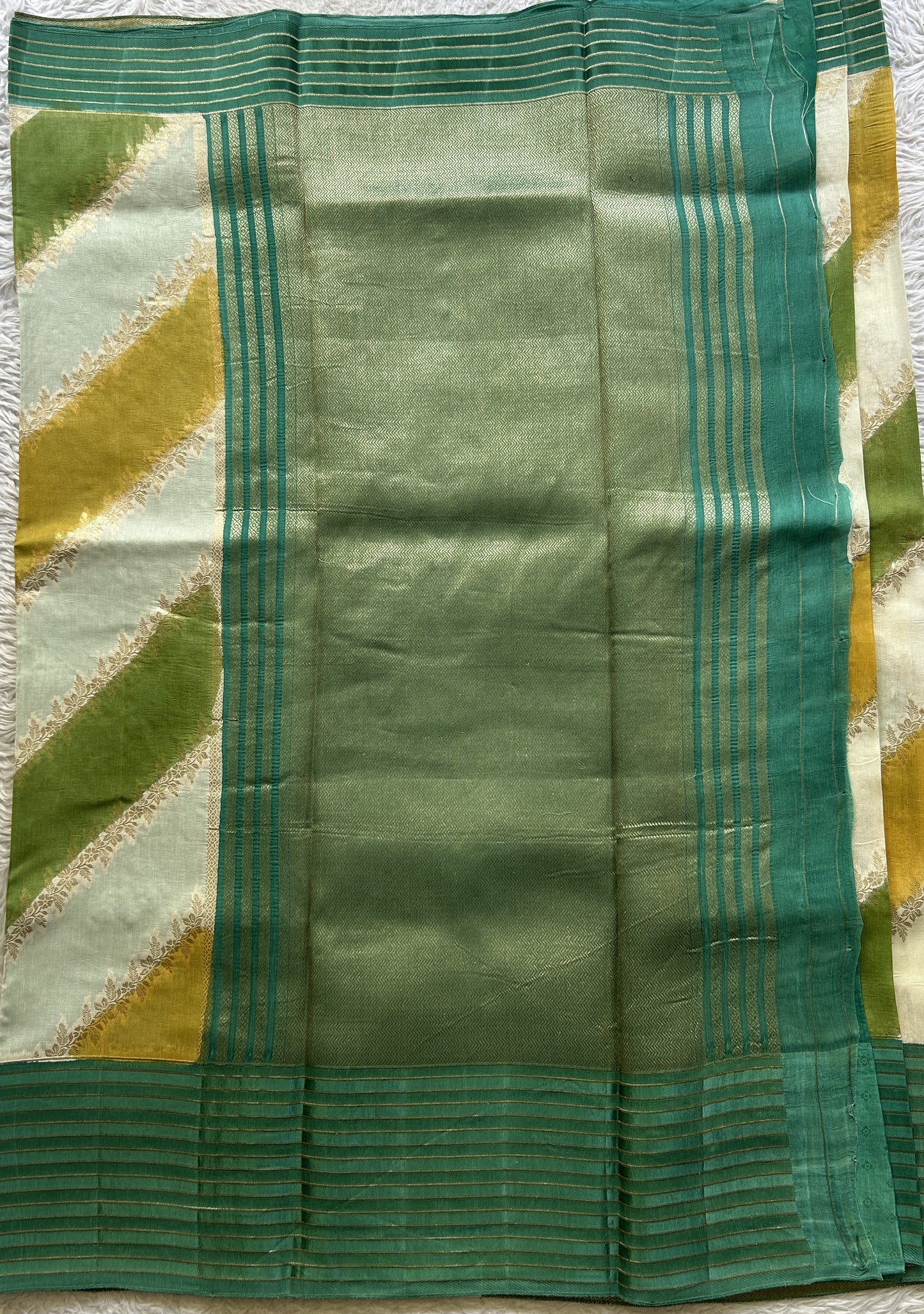 Semi Georgette Leheriya Saree Sea Green Colored Complemented with a Zari Border. - Sampradaya Designer Studio