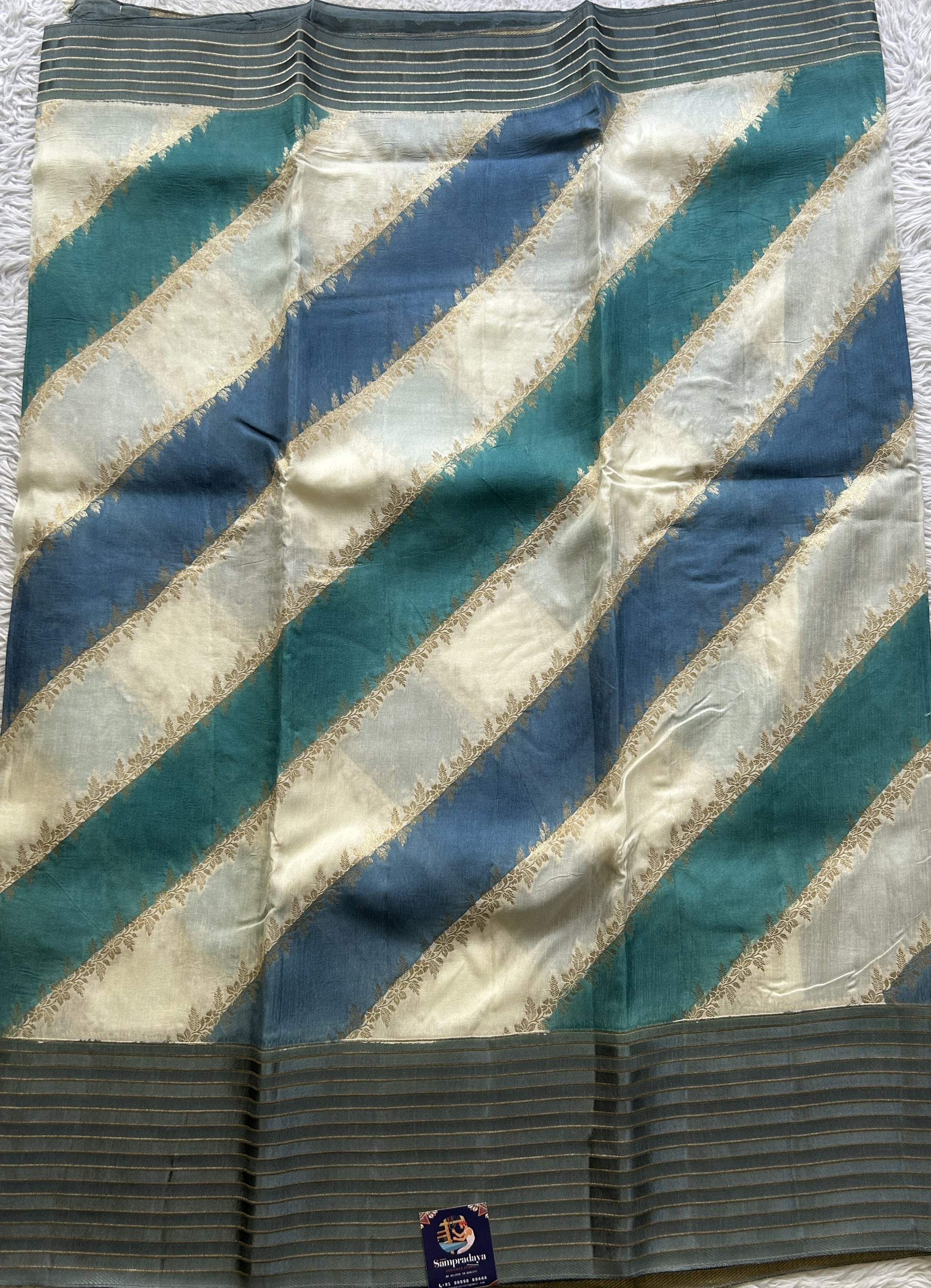 Semi Georgette Leheriya Saree Teal Blue Colored Complemented with a Zari Border. - Sampradaya Designer Studio