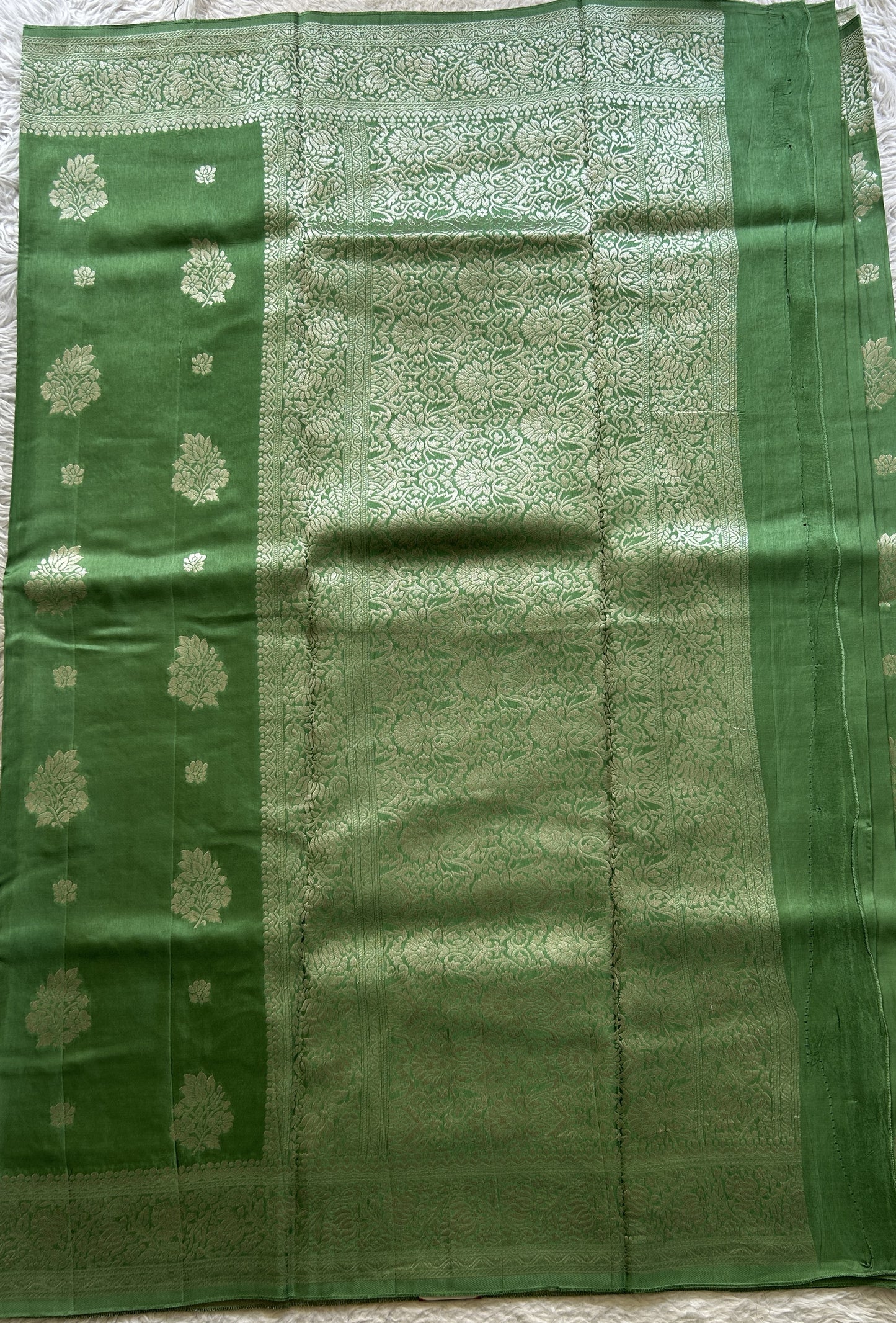 Semi Georgette Saree Emerald Colored Complemented with a Zari Border. - Sampradaya Designer Studio