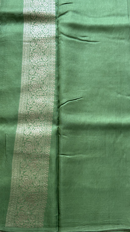 Semi Georgette Saree Emerald Colored Complemented with a Zari Border. - Sampradaya Designer Studio