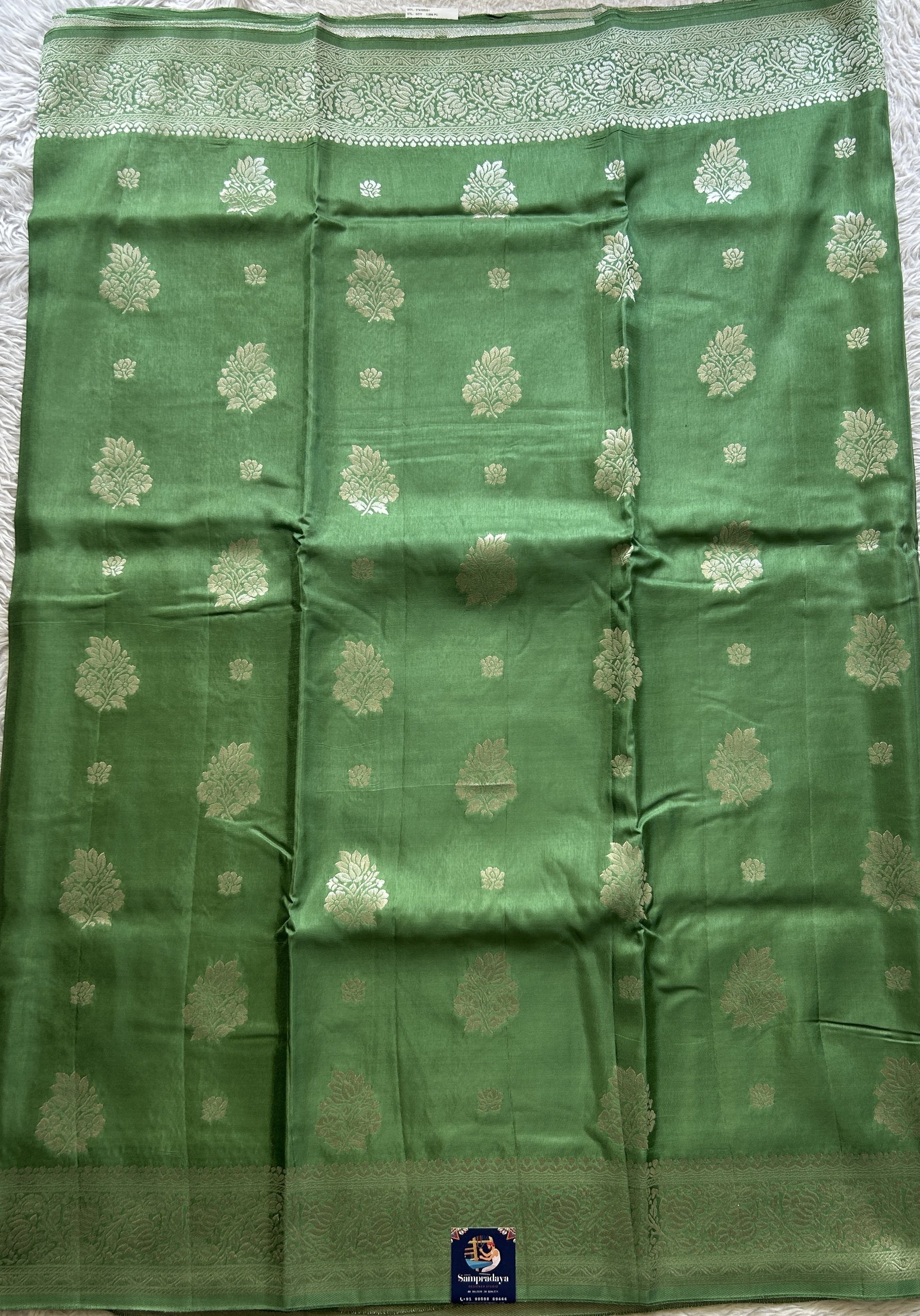 Semi Georgette Saree Emerald Colored Complemented with a Zari Border. - Sampradaya Designer Studio