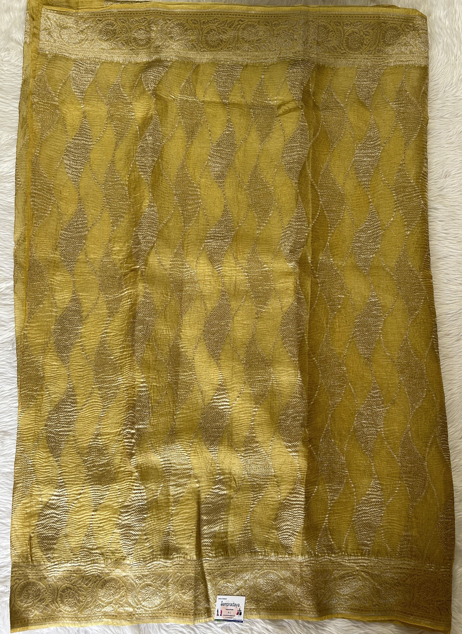 Banarasi Crushed Silk Saree Pastel Yellow colored Saree complemented with a Zari border. - Sampradaya Designer Studio