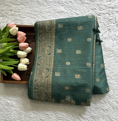 Semi Tussar Saree Bottle Green Colored complemented with a Zari Border. - Sampradaya Designer Studio