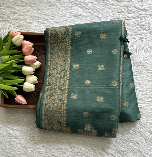 Semi Tussar Saree Bottle Green Colored complemented with a Zari Border. - Sampradaya Designer Studio