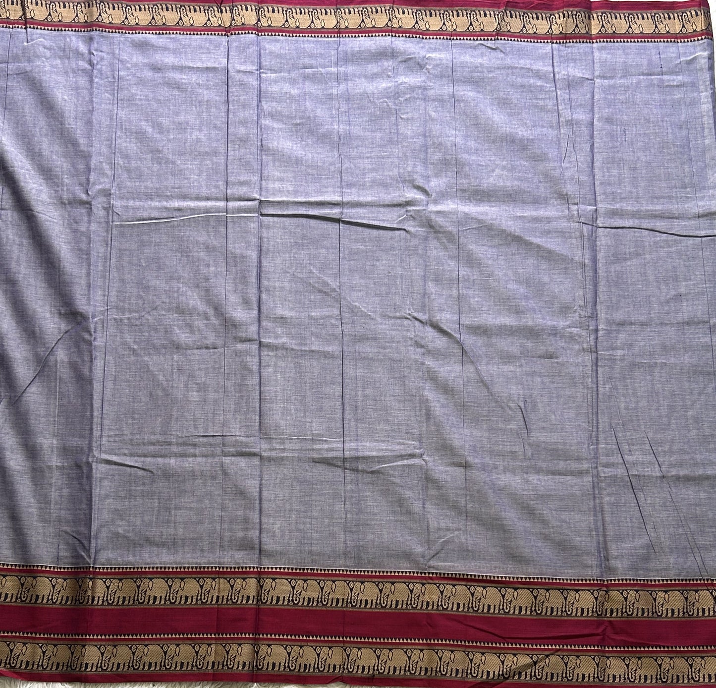 Narayanpet Cotton Saree Light Lavender Colored Complemented with a Thread Border.
