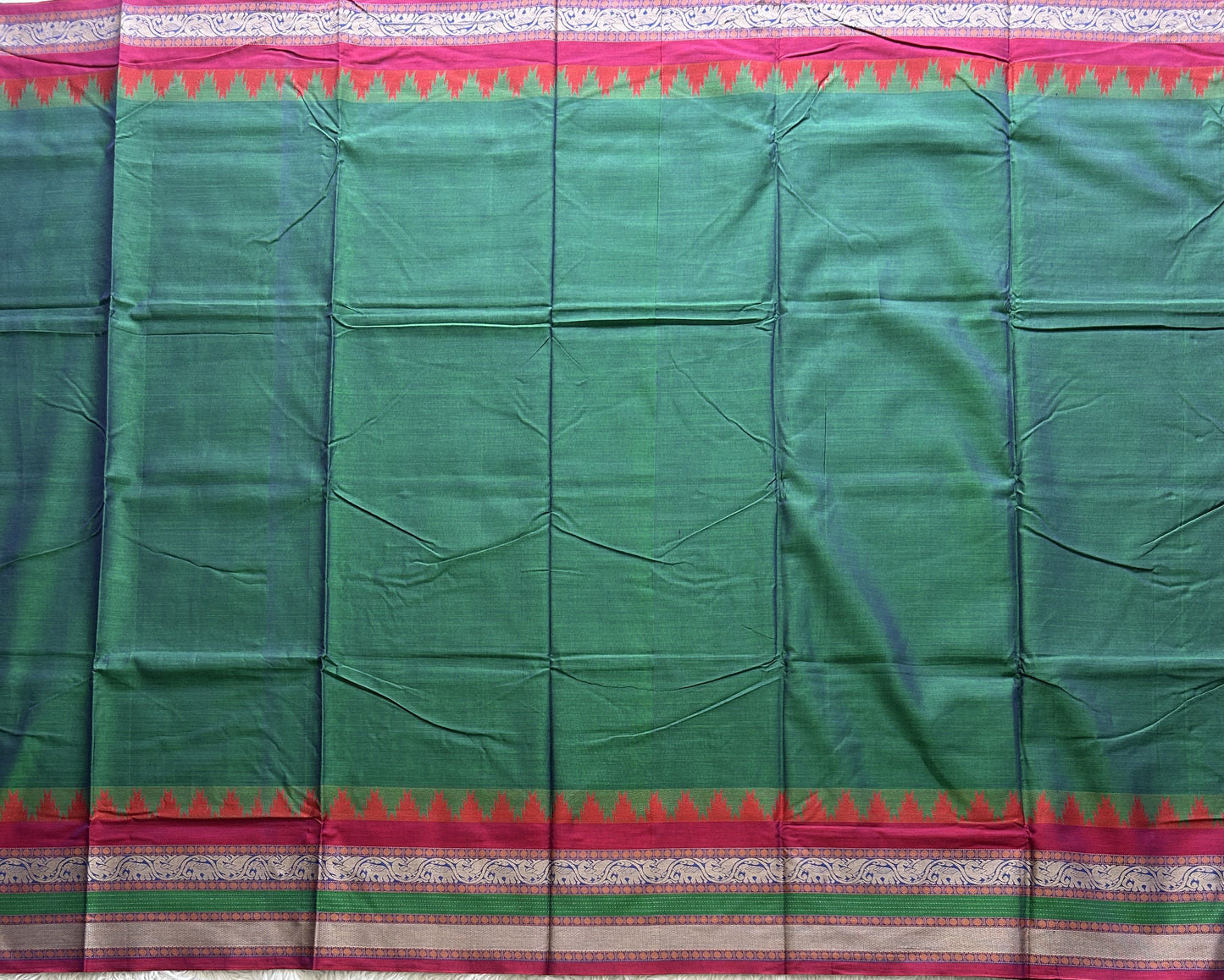 Narayanpet Cotton Saree Light Basil Green Colored Complemented with a Thread Border.