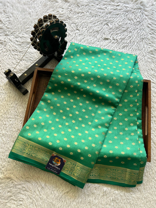 Pure Chiniya Silk Saree Dark Jungle Colored Elegantly Paired with a Gold Zari Border.
