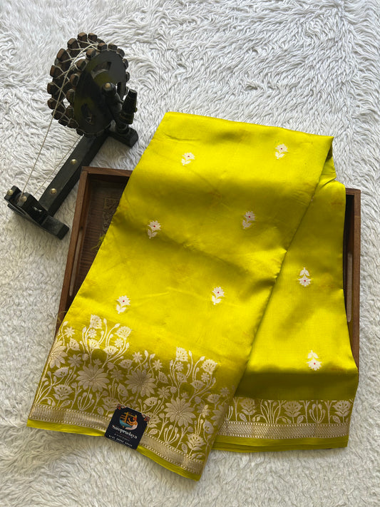 Pure Chiniya Silk Saree Light Yellow Colored Elegantly Paired with a Silver Zari Border.