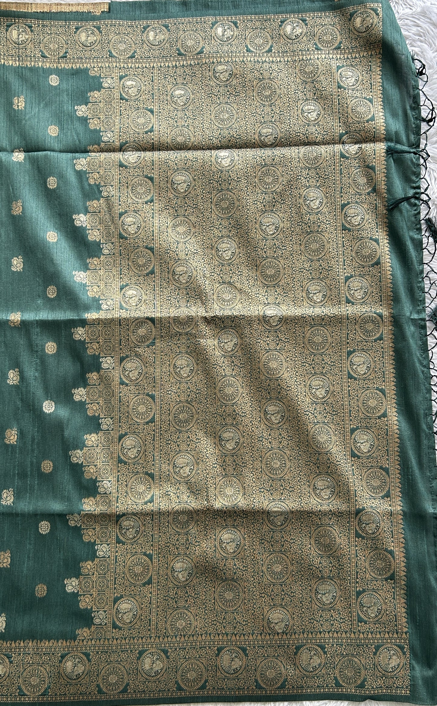 Semi Tussar Saree Bottle Green Colored complemented with a Zari Border. - Sampradaya Designer Studio