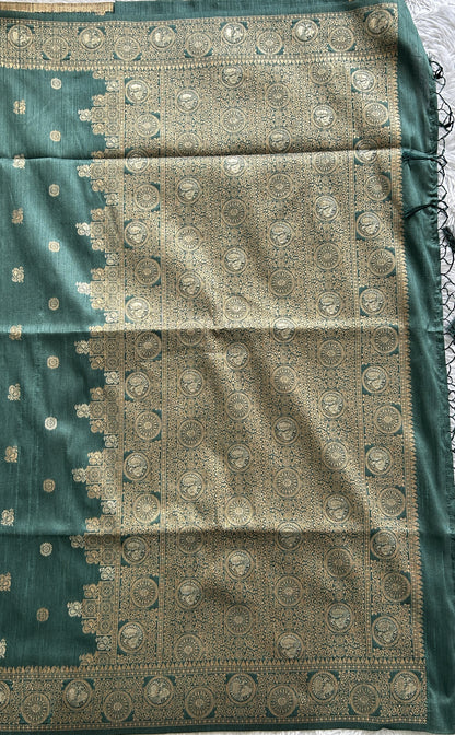 Semi Tussar Saree Bottle Green Colored complemented with a Zari Border. - Sampradaya Designer Studio