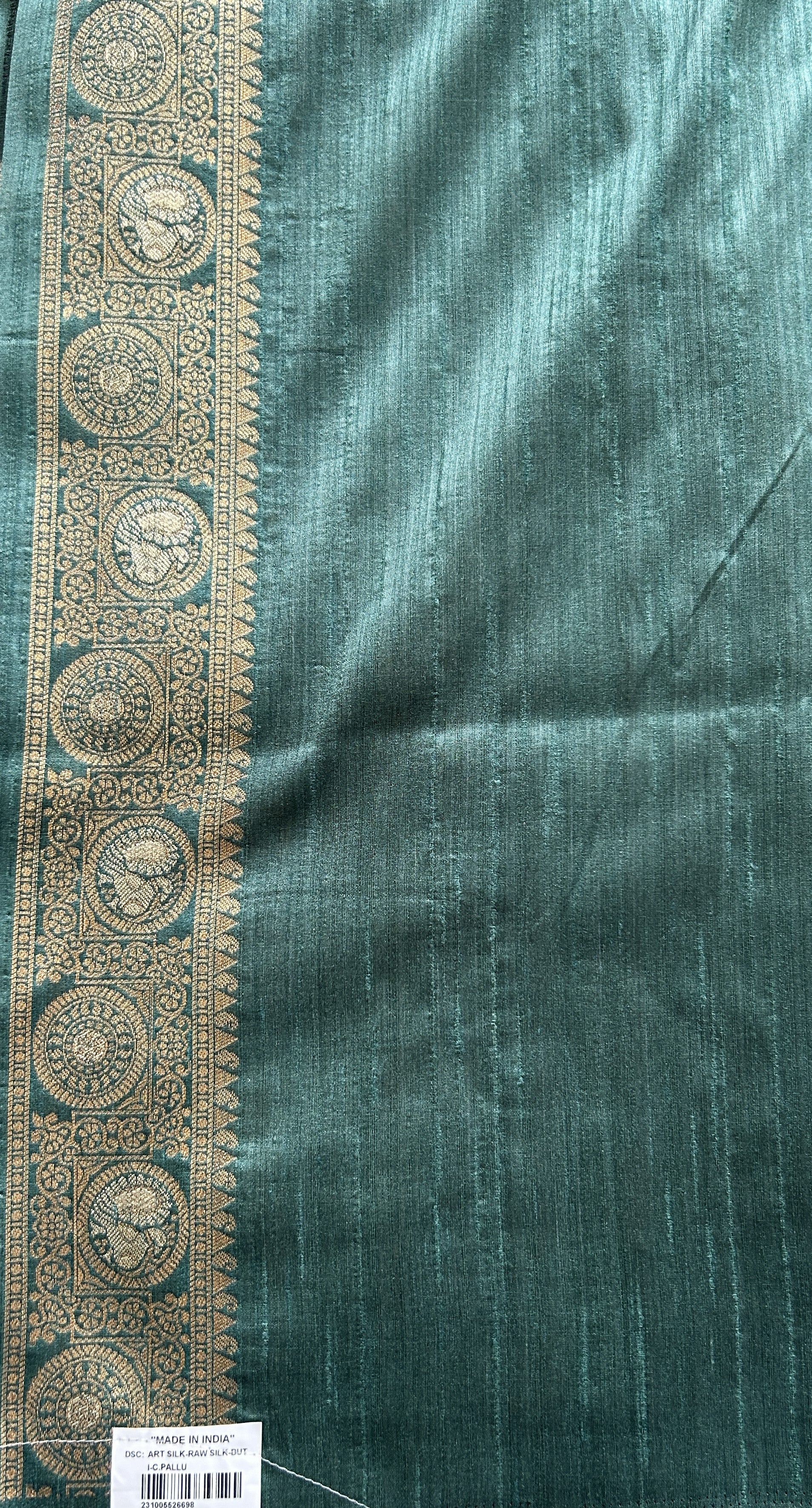 Semi Tussar Saree Bottle Green Colored complemented with a Zari Border. - Sampradaya Designer Studio