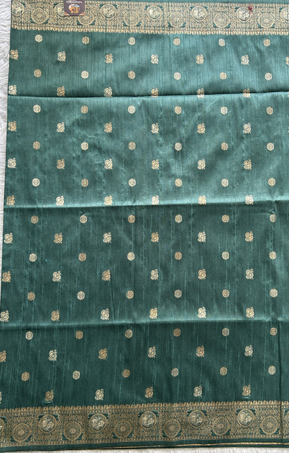 Semi Tussar Saree Bottle Green Colored complemented with a Zari Border. - Sampradaya Designer Studio