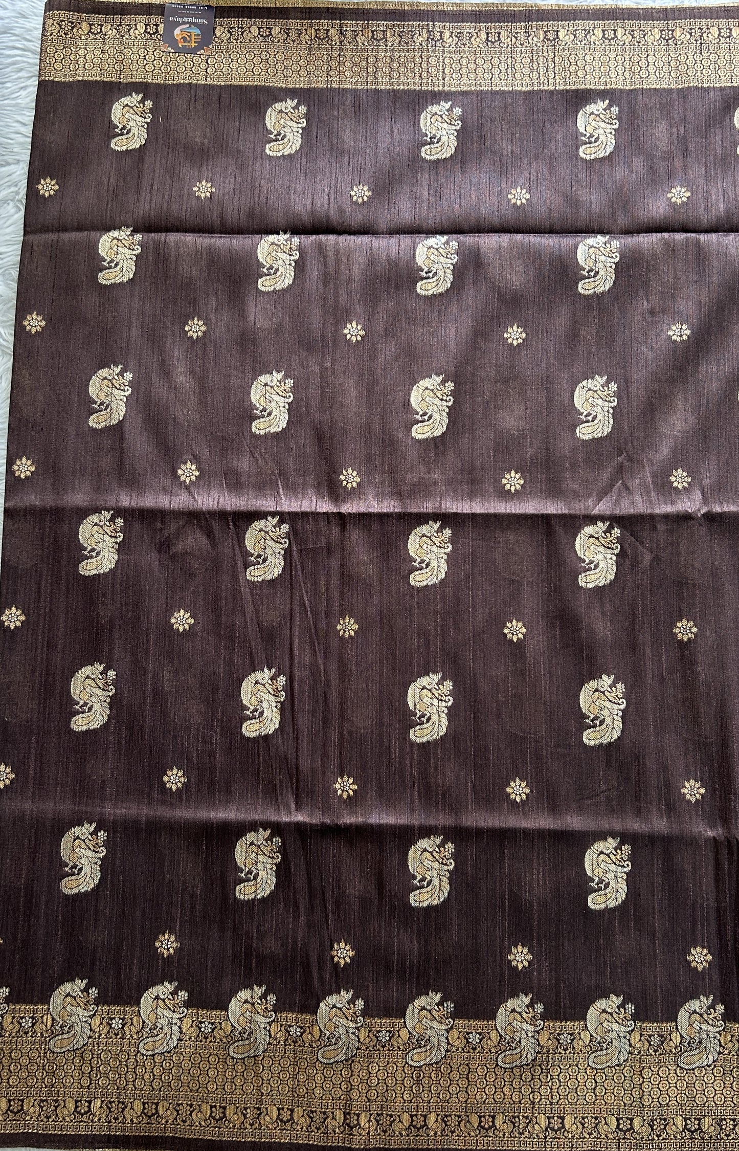 Semi Tussar Saree Snuff Colored complemented with a Zari Border. - Sampradaya Designer Studio