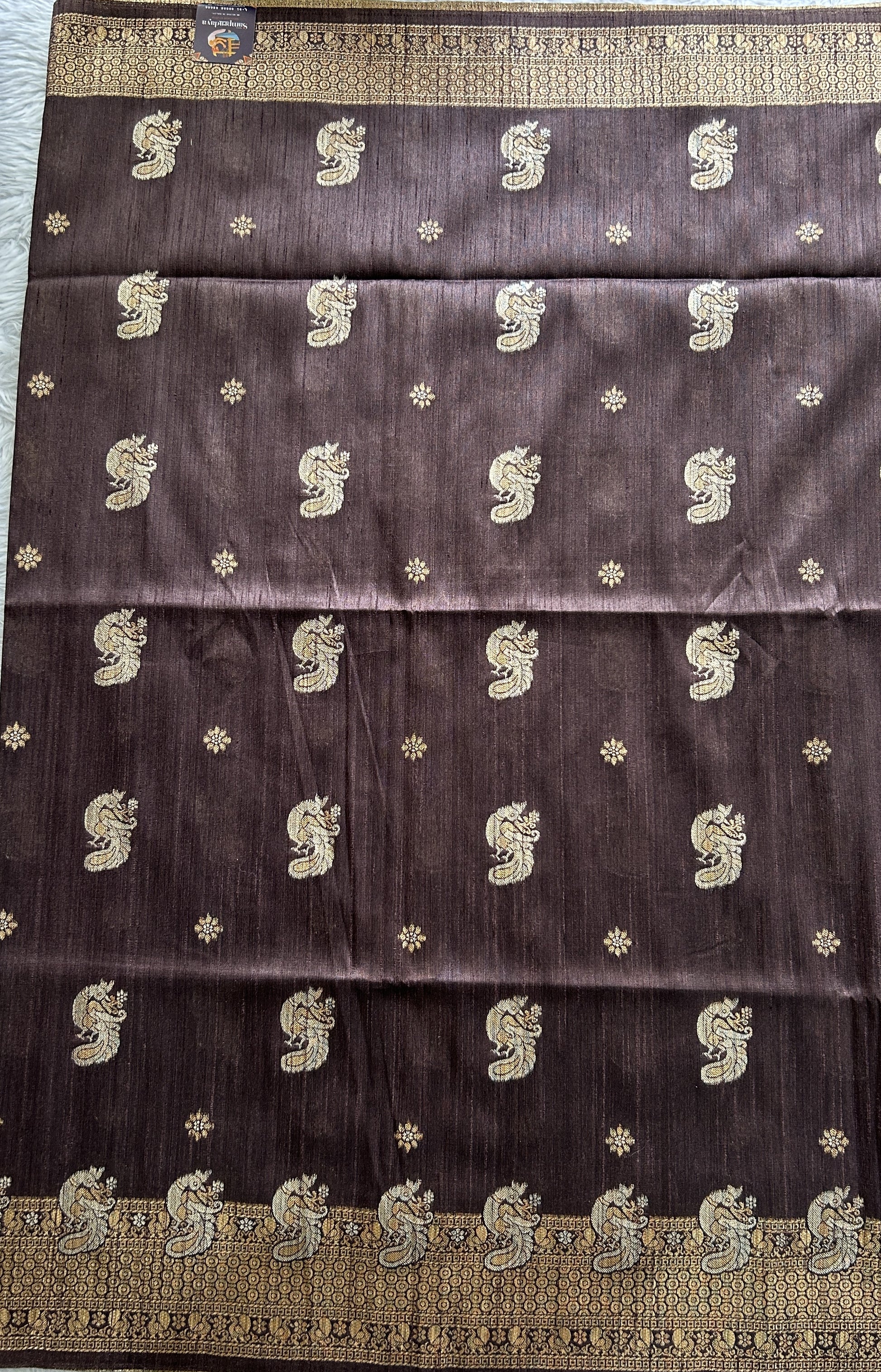 Semi Tussar Saree Snuff Colored complemented with a Zari Border. - Sampradaya Designer Studio