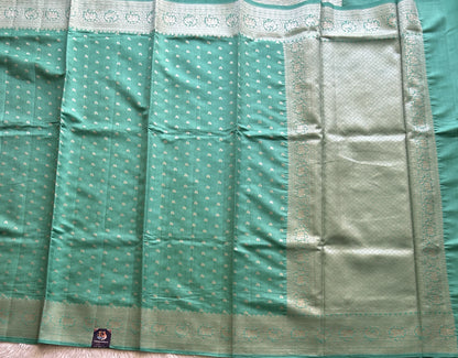 Pure Chiniya Silk Saree Jungle Colored Elegantly Paired with a Silver Zari Border. - Sampradaya Designer Studio