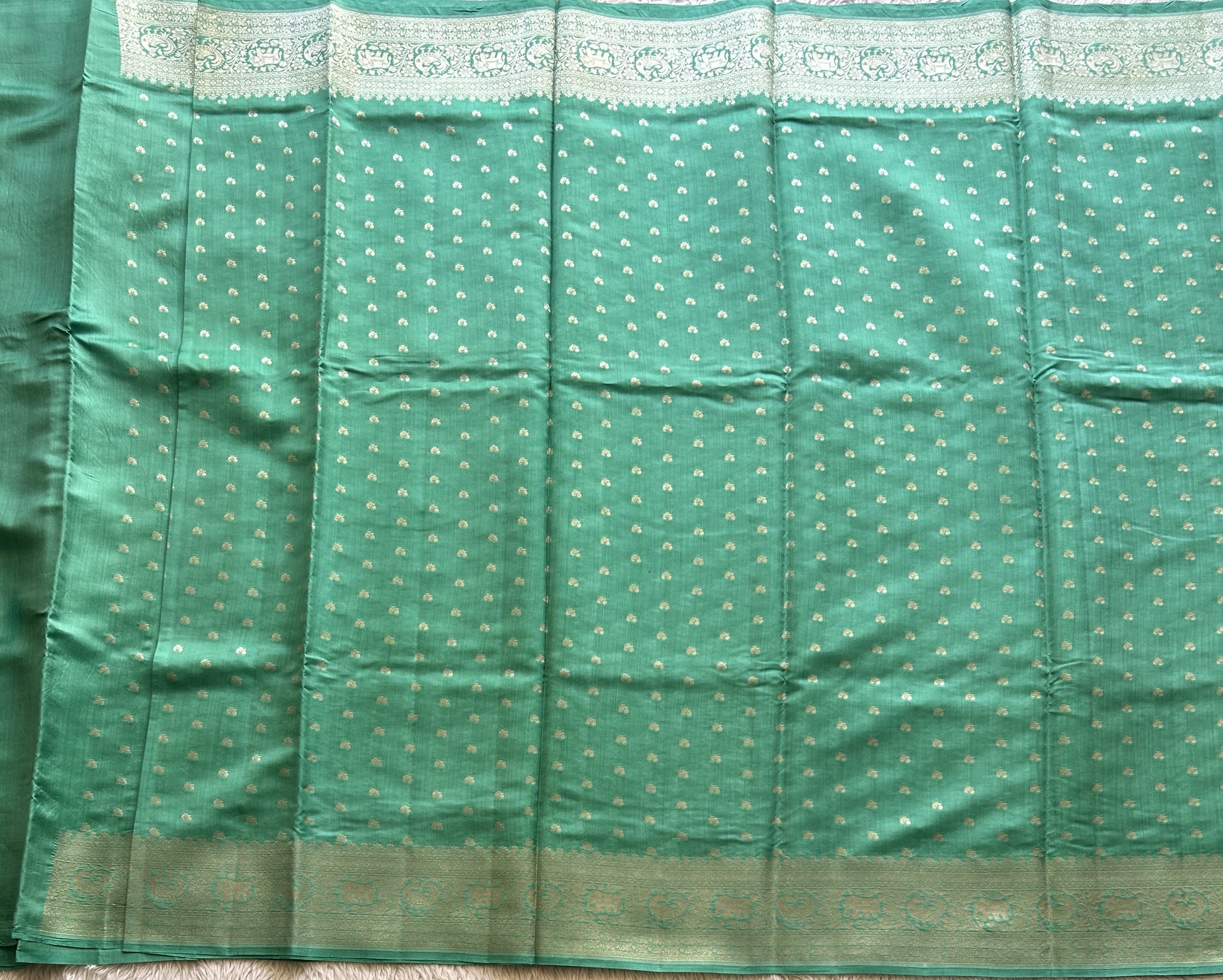 Pure Chiniya Silk Saree Jungle Colored Elegantly Paired with a Silver Zari Border. - Sampradaya Designer Studio