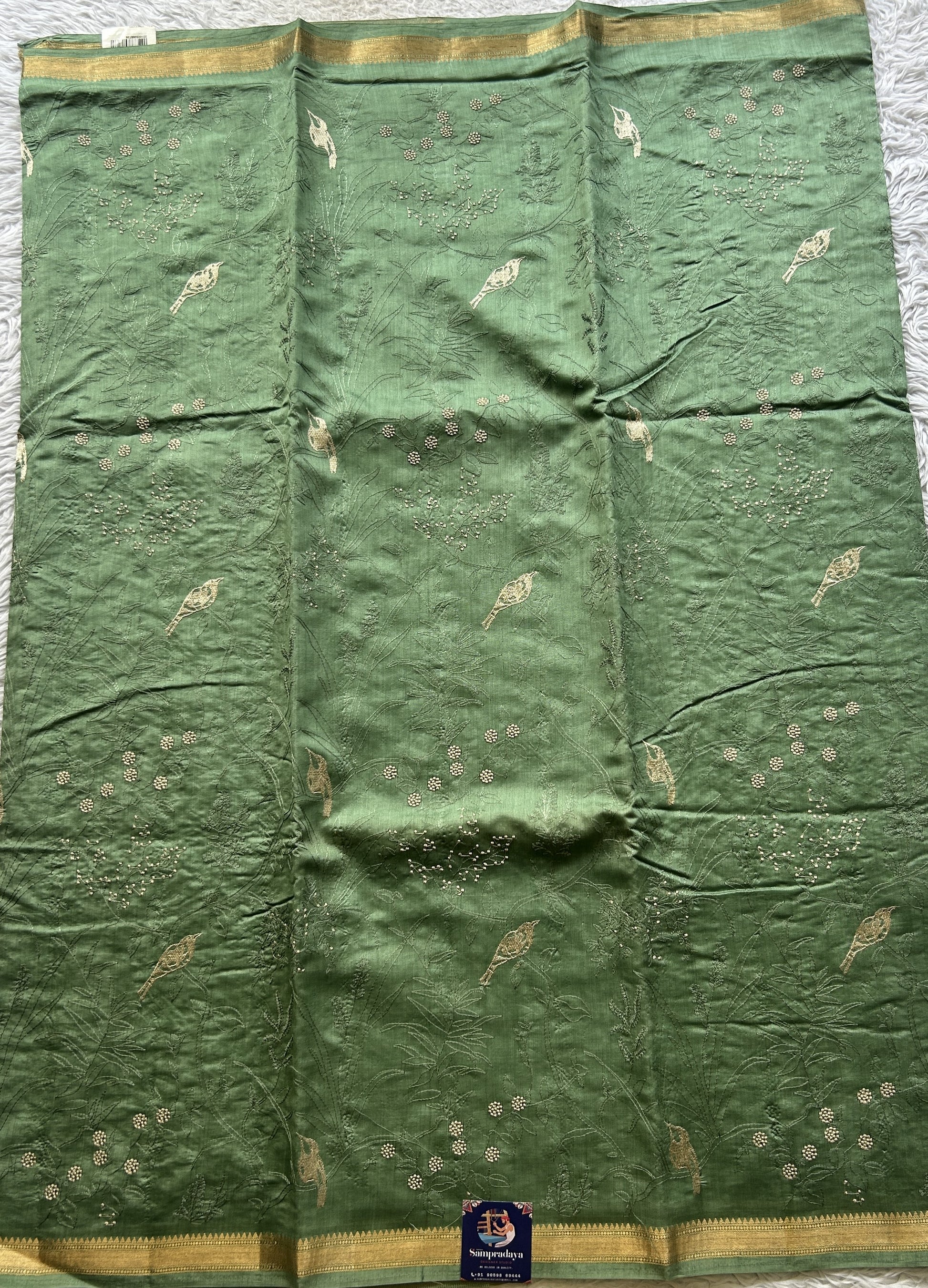 Chiniya Silk Saree Cadmium Green Colored Exquisite with a Zari Border. - Sampradaya Designer Studio