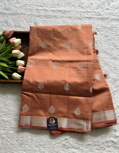 Semi Tussar Saree Peach Colored complemented with a Zari Border. - Sampradaya Designer Studio