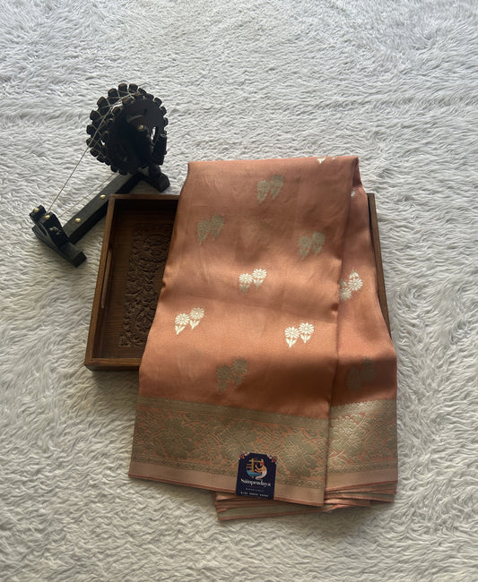 Semi Tissue Georgette Saree Peach Colored Paired with a Zari Border. - Sampradaya Designer Studio