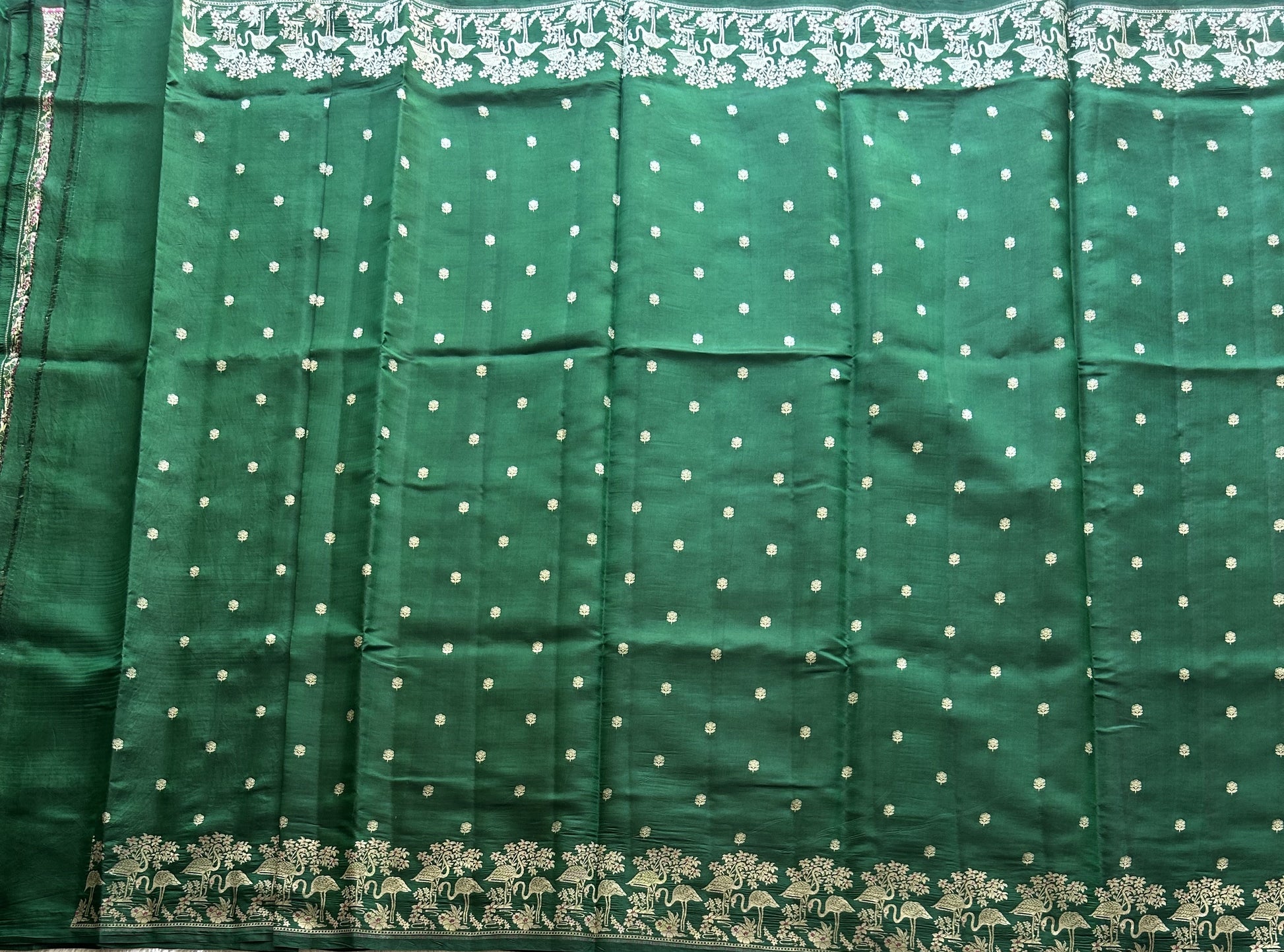 Pure Chiniya Silk Saree Dark Green Colored Elegantly Paired with a Silver Zari Border. - Sampradaya Designer Studio