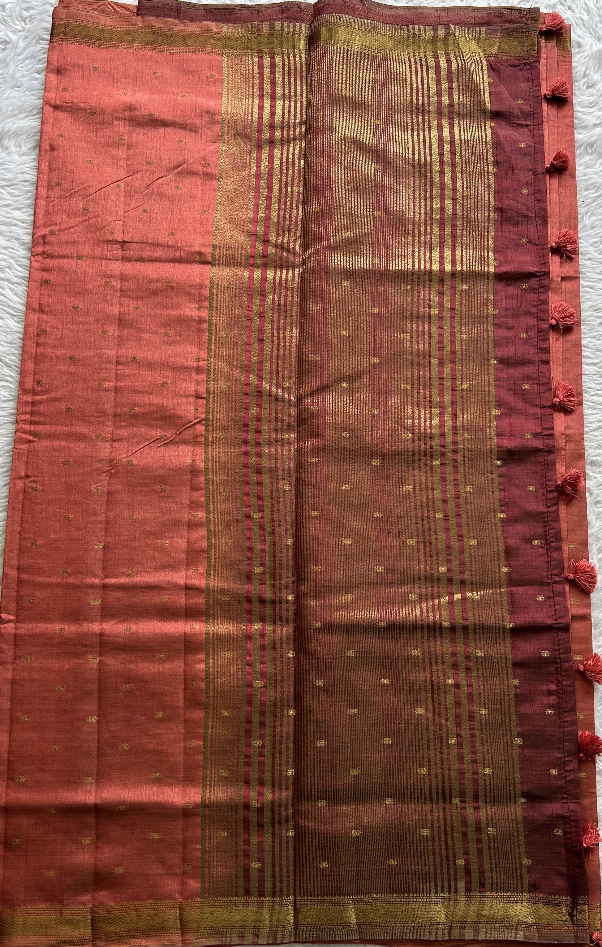 Semi Tussar Saree Dark Peach Colored Complemented with a Zari Border. - Sampradaya Designer Studio
