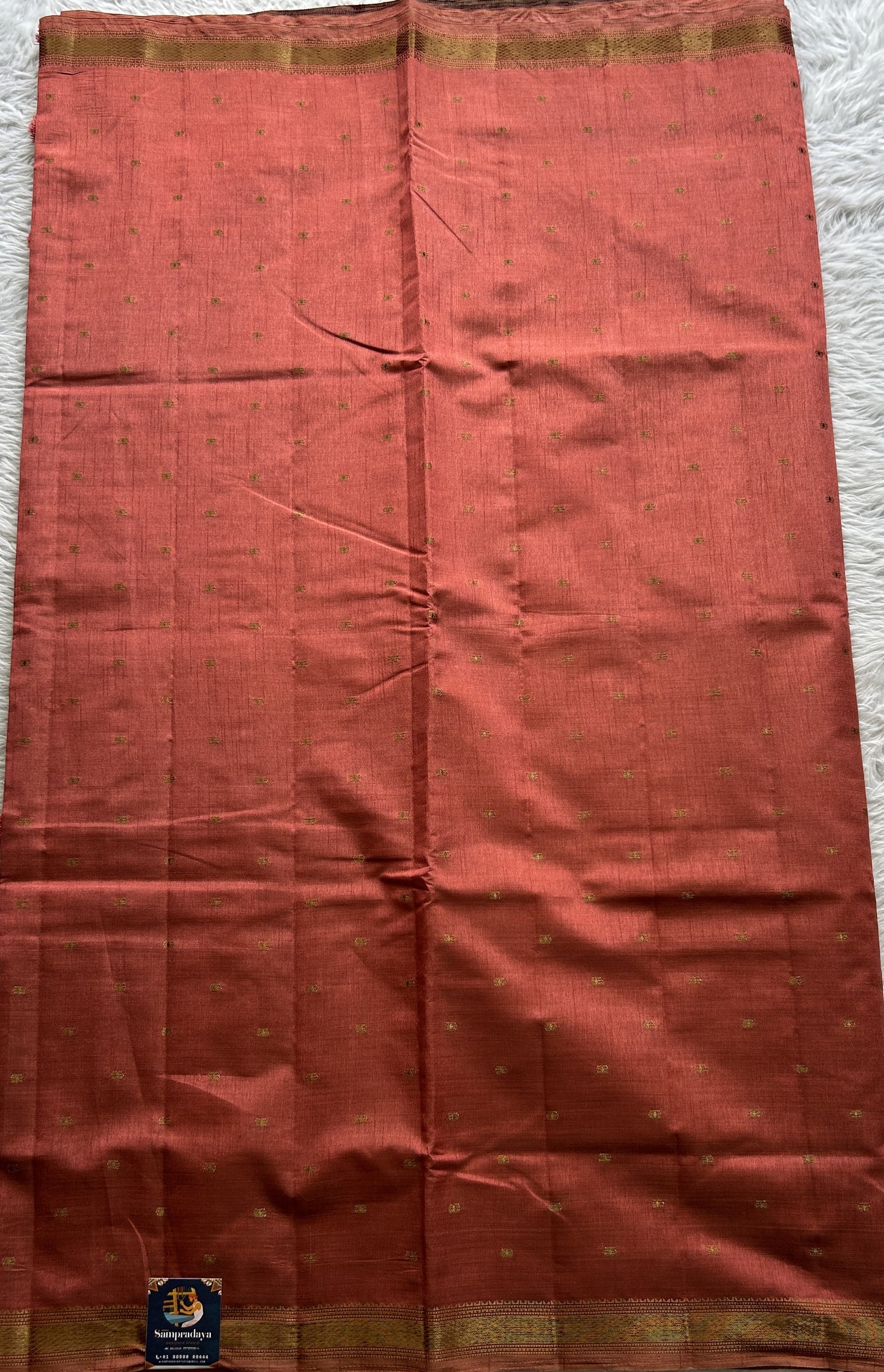 Semi Tussar Saree Dark Peach Colored Complemented with a Zari Border. - Sampradaya Designer Studio