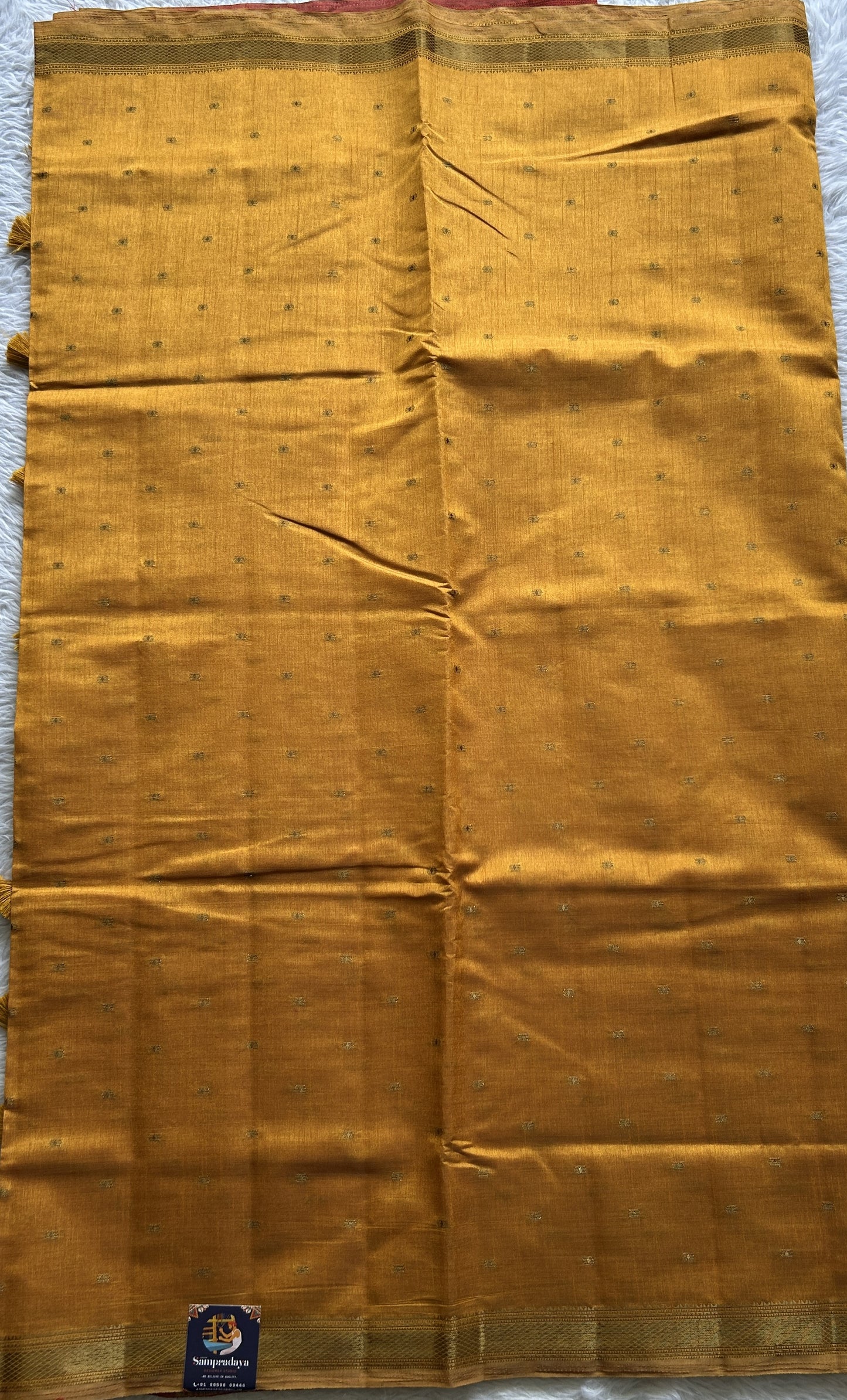 Semi Tussar Saree Turmeric Yellow Colored Complemented with a Zari Border. - Sampradaya Designer Studio