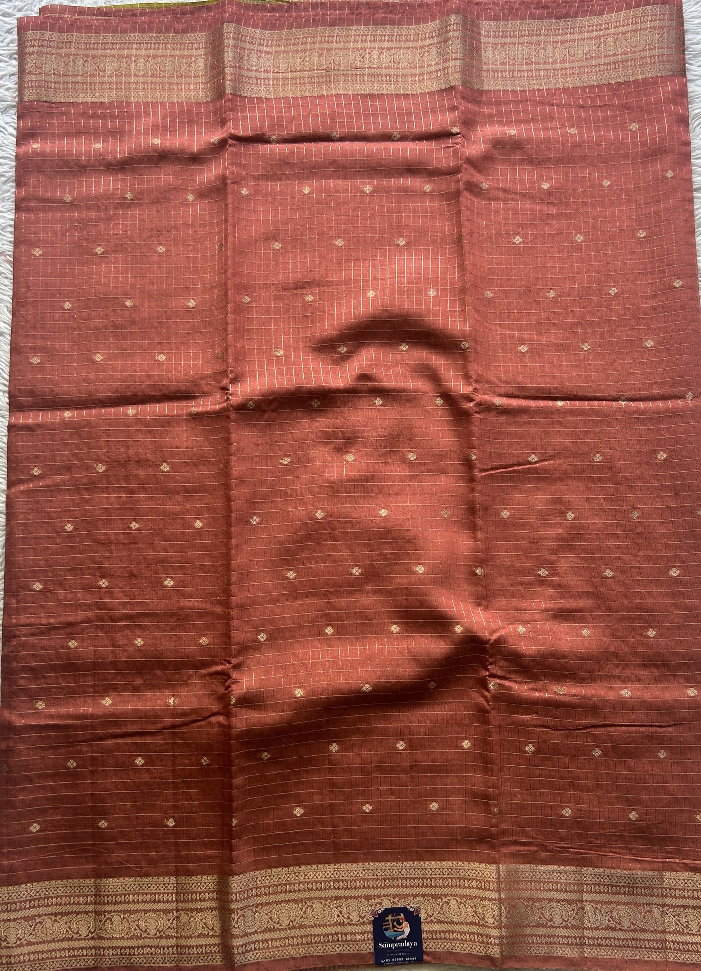 Semi Georgette Checks Saree Melon Colored Paired with a Zari Border. - Sampradaya Designer Studio