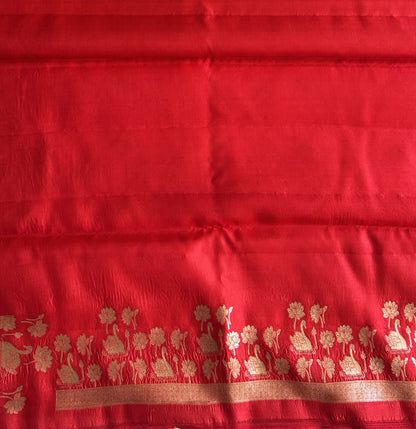 Pure Chiniya Silk Saree Tomato Red Colored Elegantly Paired with a Silver Zari Border. - Sampradaya Designer Studio