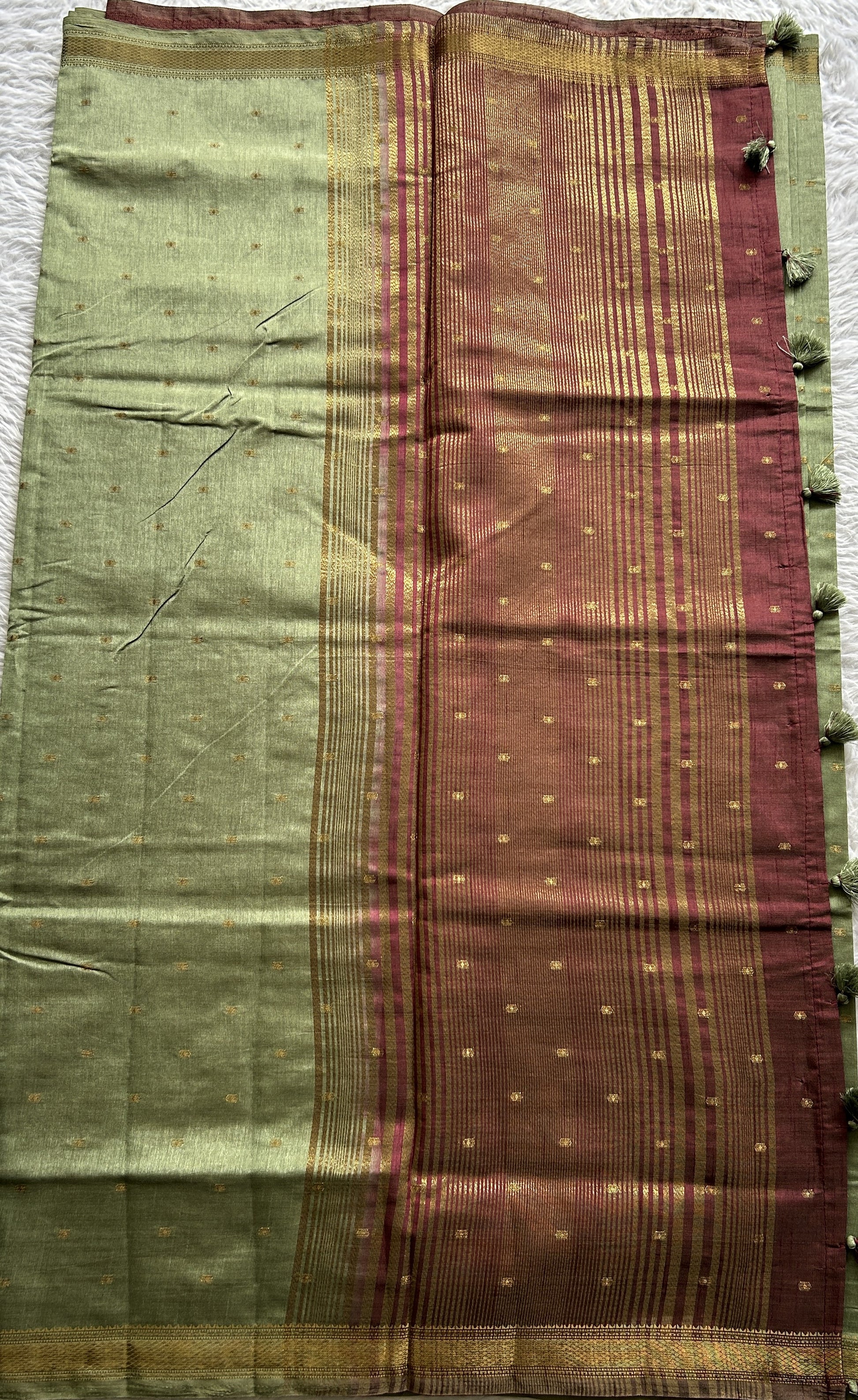 Semi Tussar Saree Light Olive Green Colored Complemented with a Zari Border. - Sampradaya Designer Studio