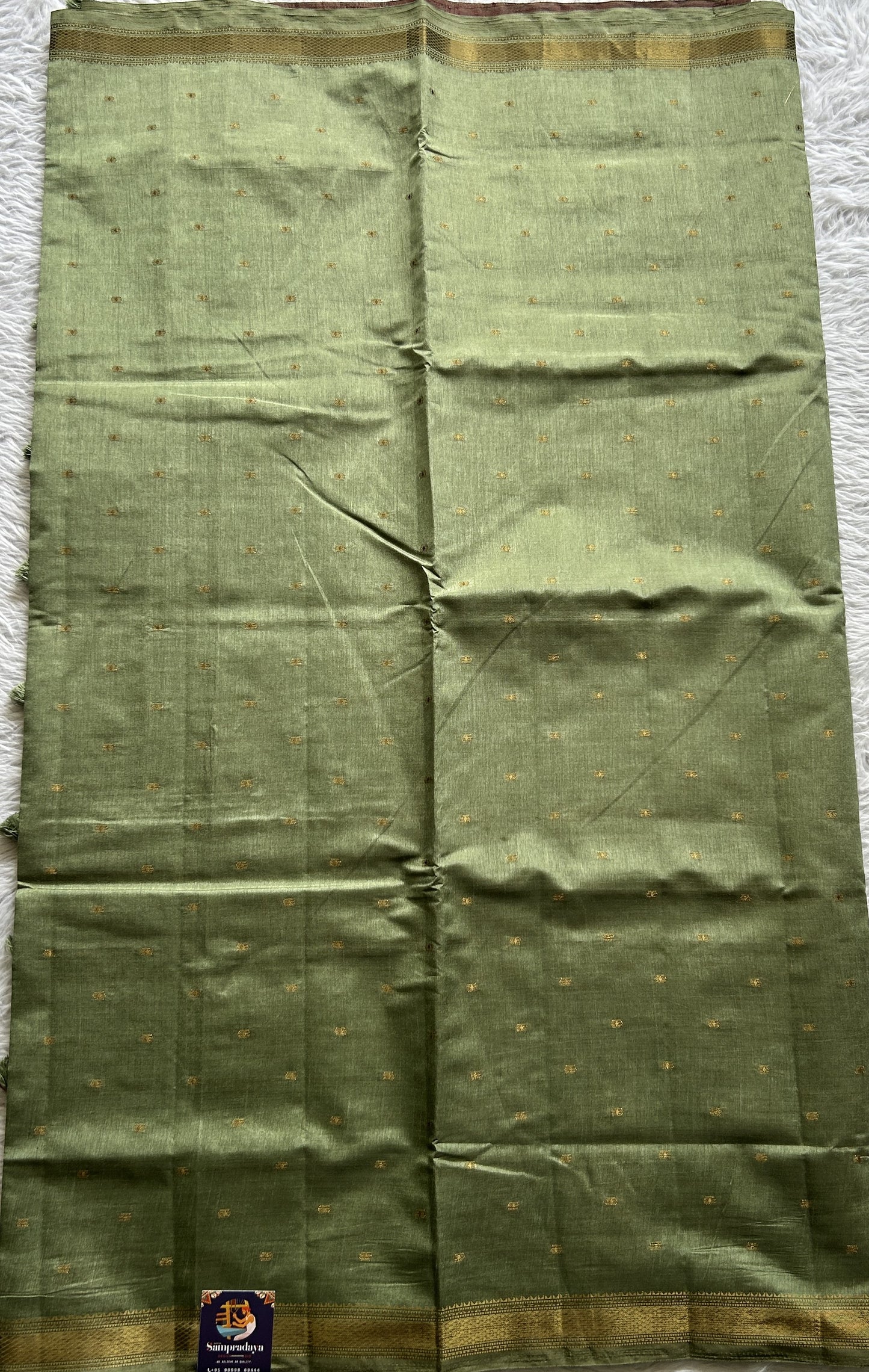 Semi Tussar Saree Light Olive Green Colored Complemented with a Zari Border. - Sampradaya Designer Studio