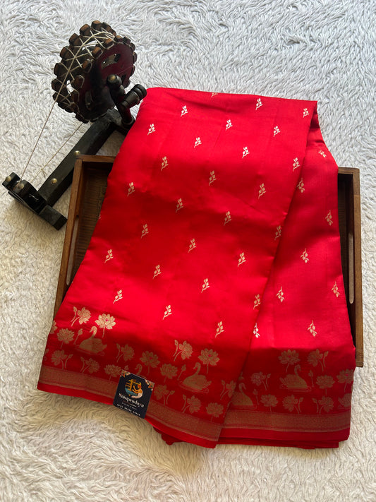 Pure Chiniya Silk Saree Tomato Red Colored Elegantly Paired with a Silver Zari Border.