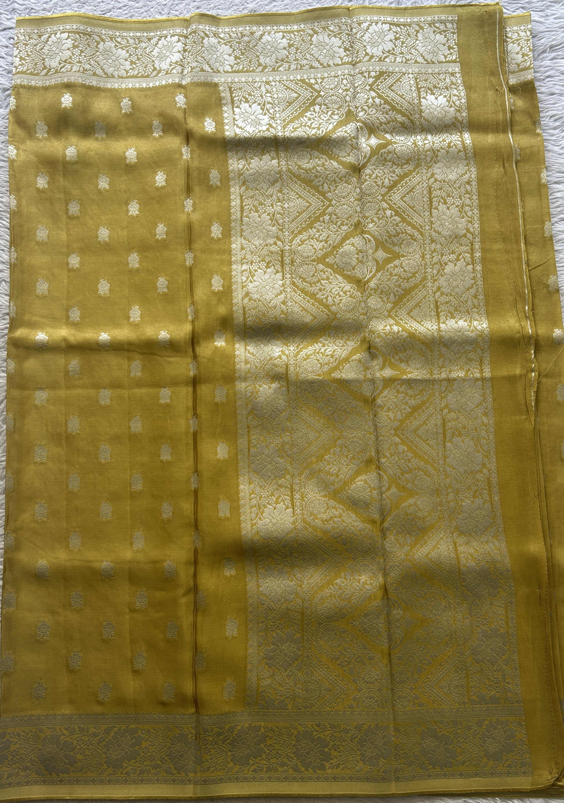 Semi Tissue Georgette Saree Yellow Colored Paired with a Zari Border. - Sampradaya Designer Studio
