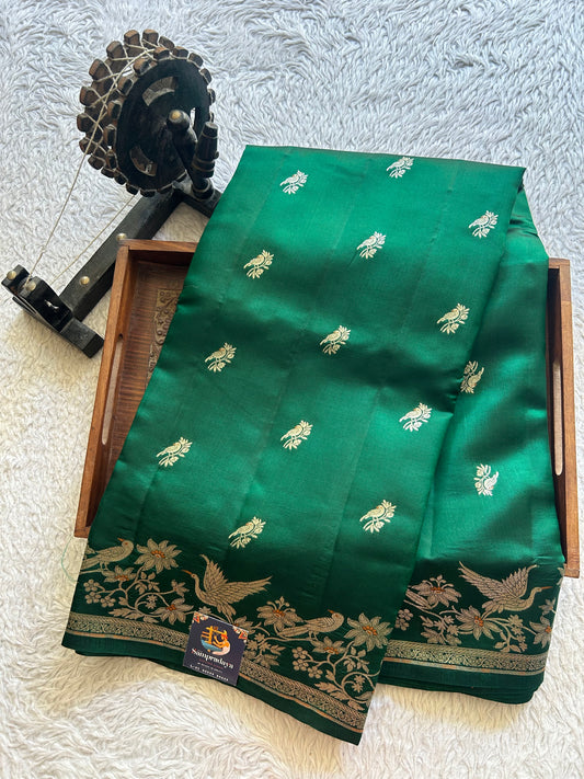 Pure Chiniya Silk Saree Forest Green Colored Elegantly Paired with a Silver Zari Border.