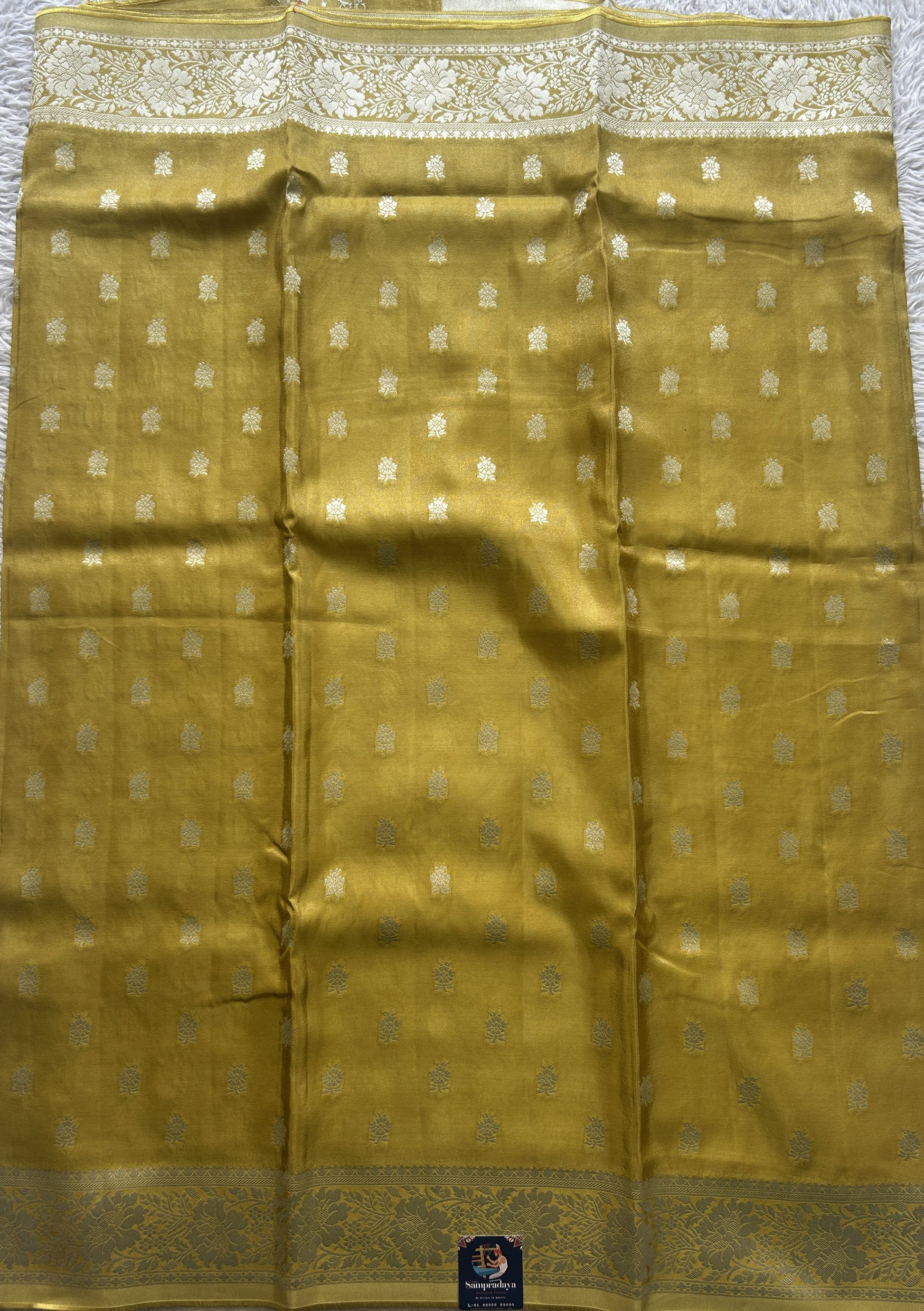 Semi Tissue Georgette Saree Yellow Colored Paired with a Zari Border. - Sampradaya Designer Studio