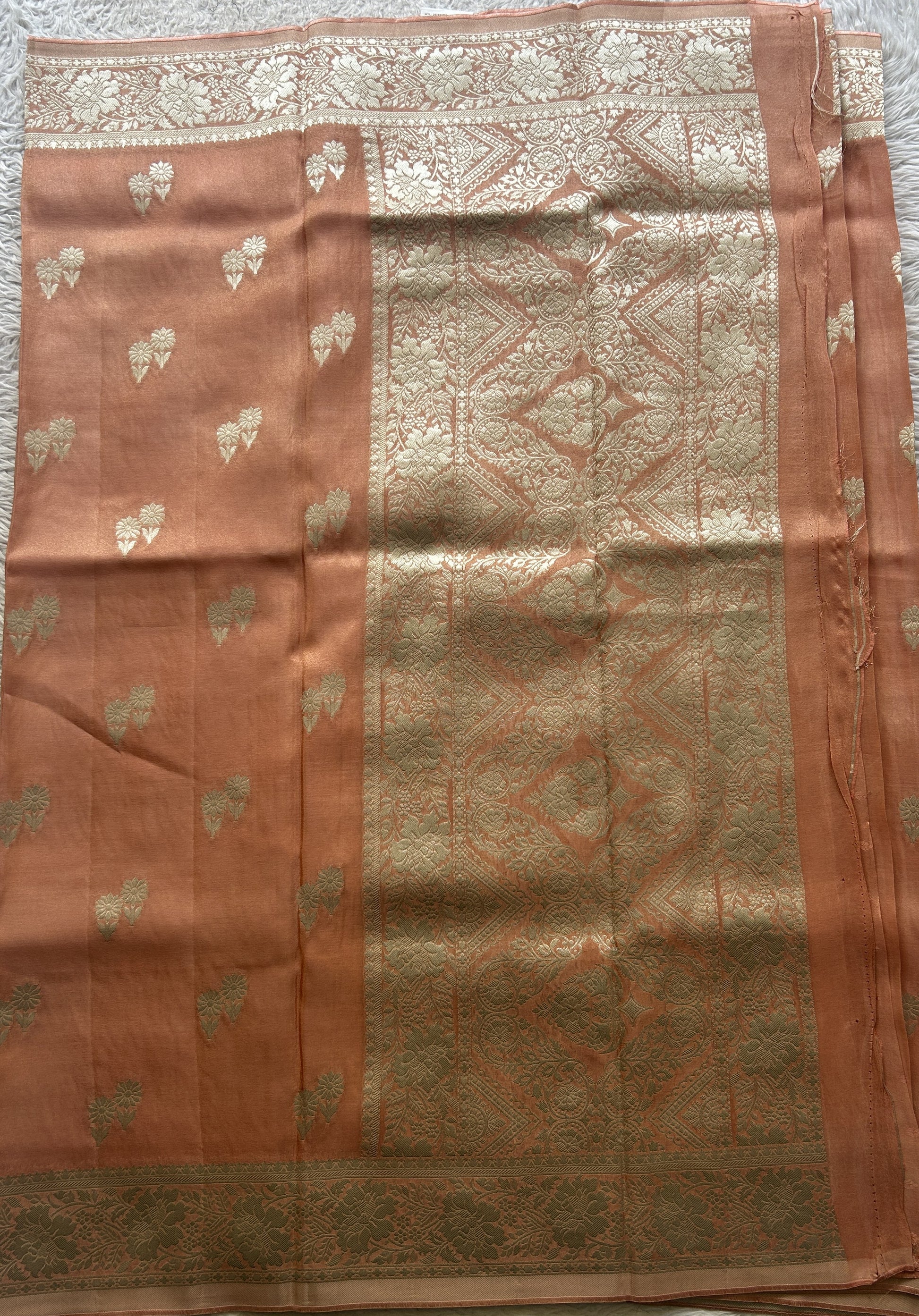 Semi Tissue Georgette Saree Peach Colored Paired with a Zari Border. - Sampradaya Designer Studio