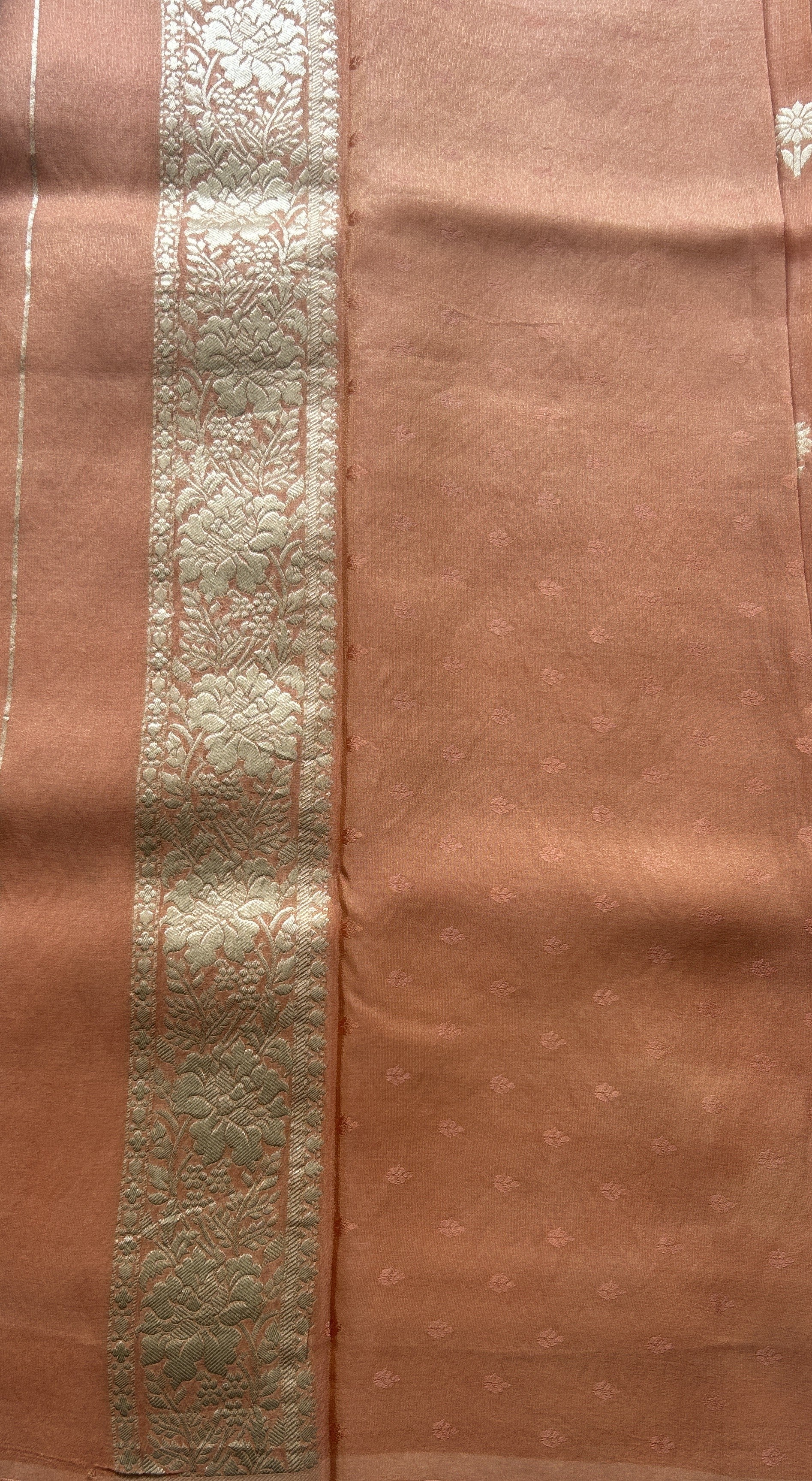 Semi Tissue Georgette Saree Peach Colored Paired with a Zari Border. - Sampradaya Designer Studio
