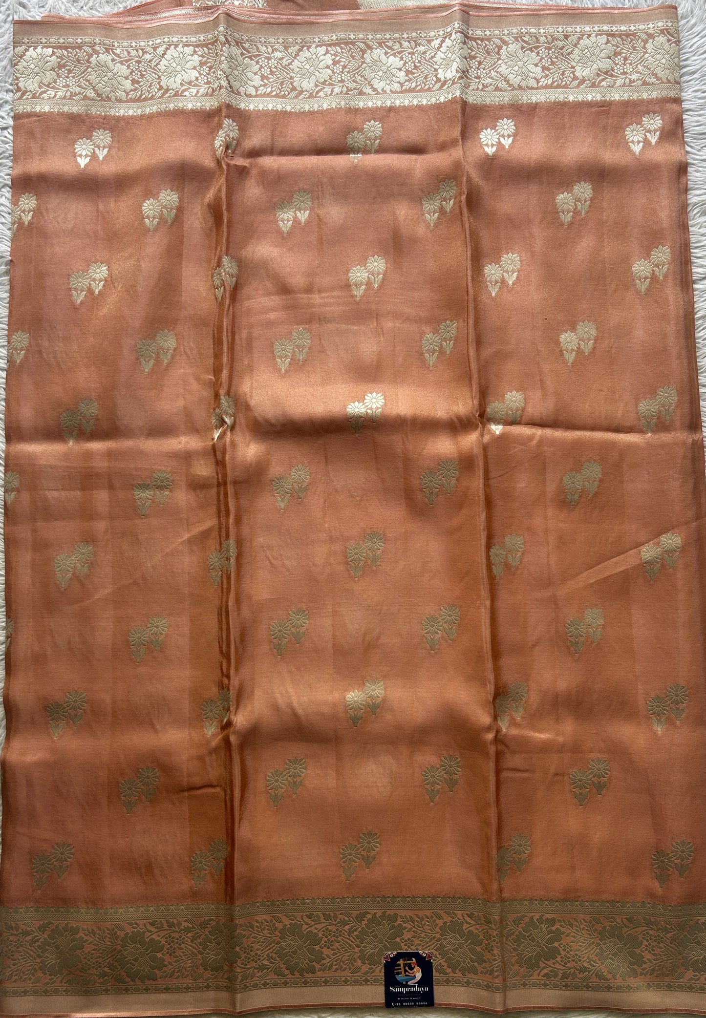 Semi Tissue Georgette Saree Peach Colored Paired with a Zari Border. - Sampradaya Designer Studio