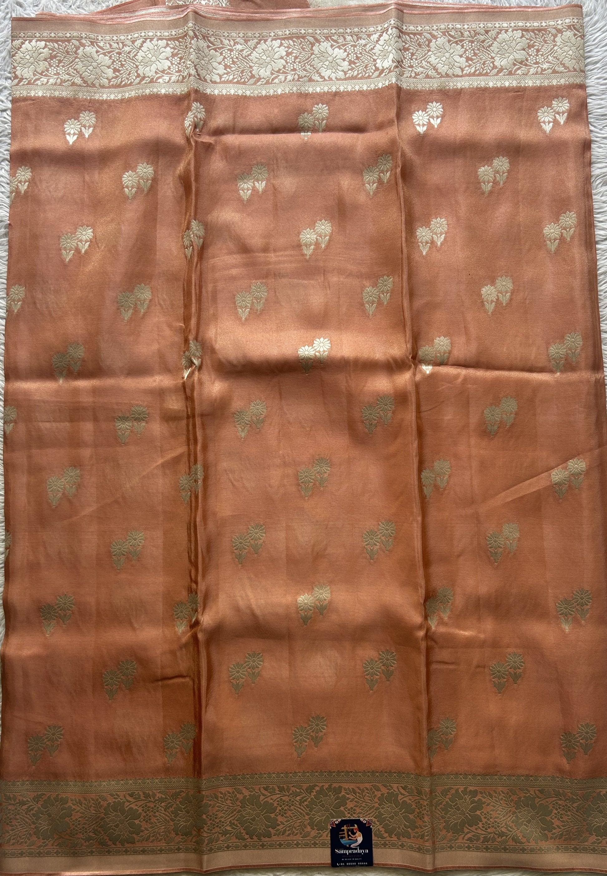 Semi Tissue Georgette Saree Peach Colored Paired with a Zari Border. - Sampradaya Designer Studio