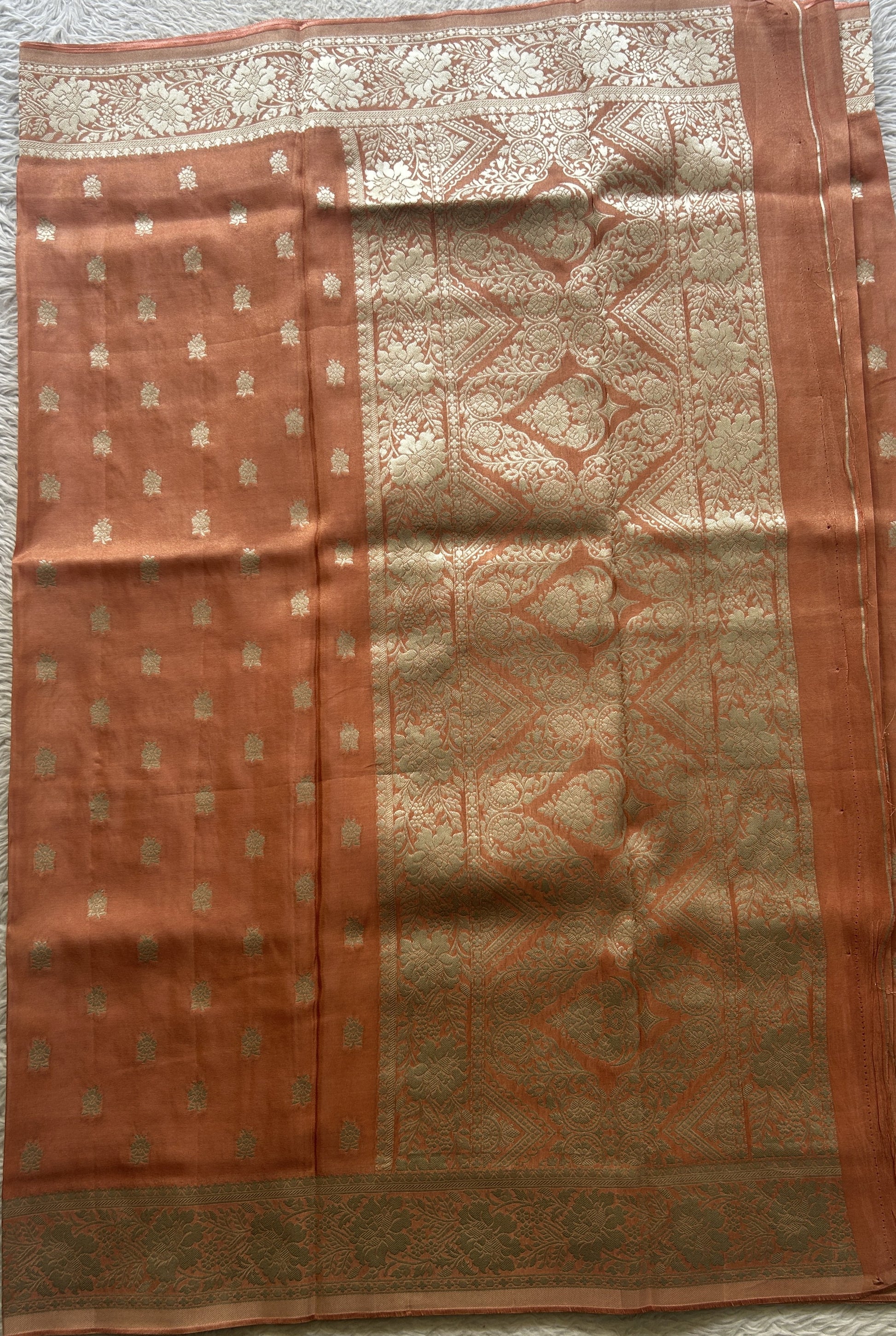 Semi Viscose Georgette Saree Light Peach Colored Paired with a Zari Border. - Sampradaya Designer Studio