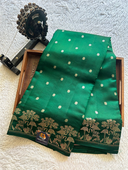 Pure Chiniya Silk Saree Dark Green Colored Elegantly Paired with a Silver Zari Border.