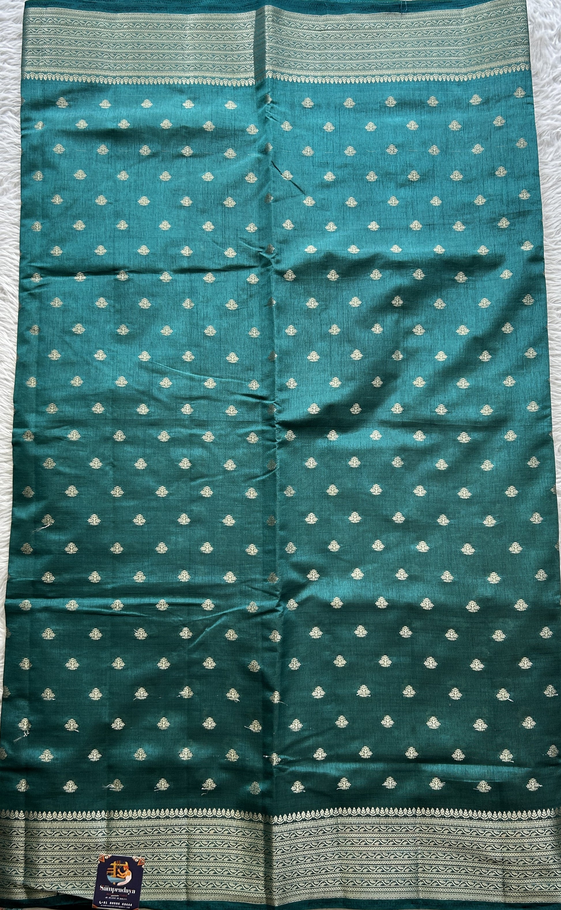 Semi Tussar Saree Teal Blue Colored Complemented with a Zari Border. - Sampradaya Designer Studio