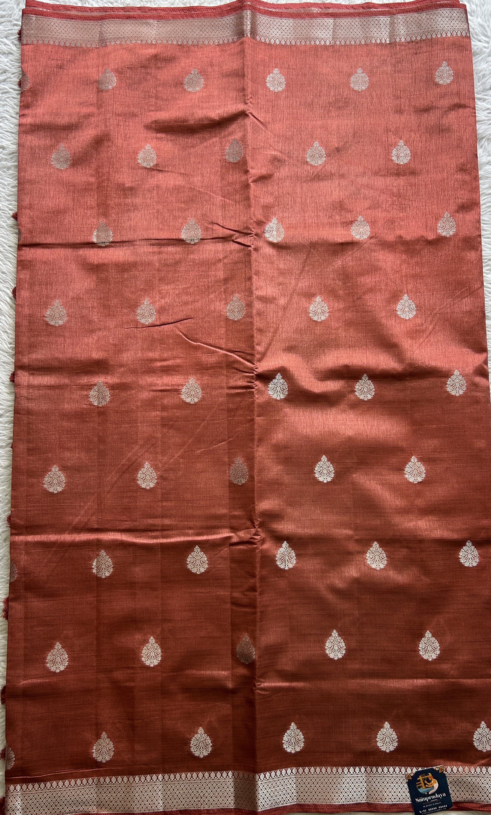Semi Tussar Saree Rust Colored complemented with a Zari Border. - Sampradaya Designer Studio