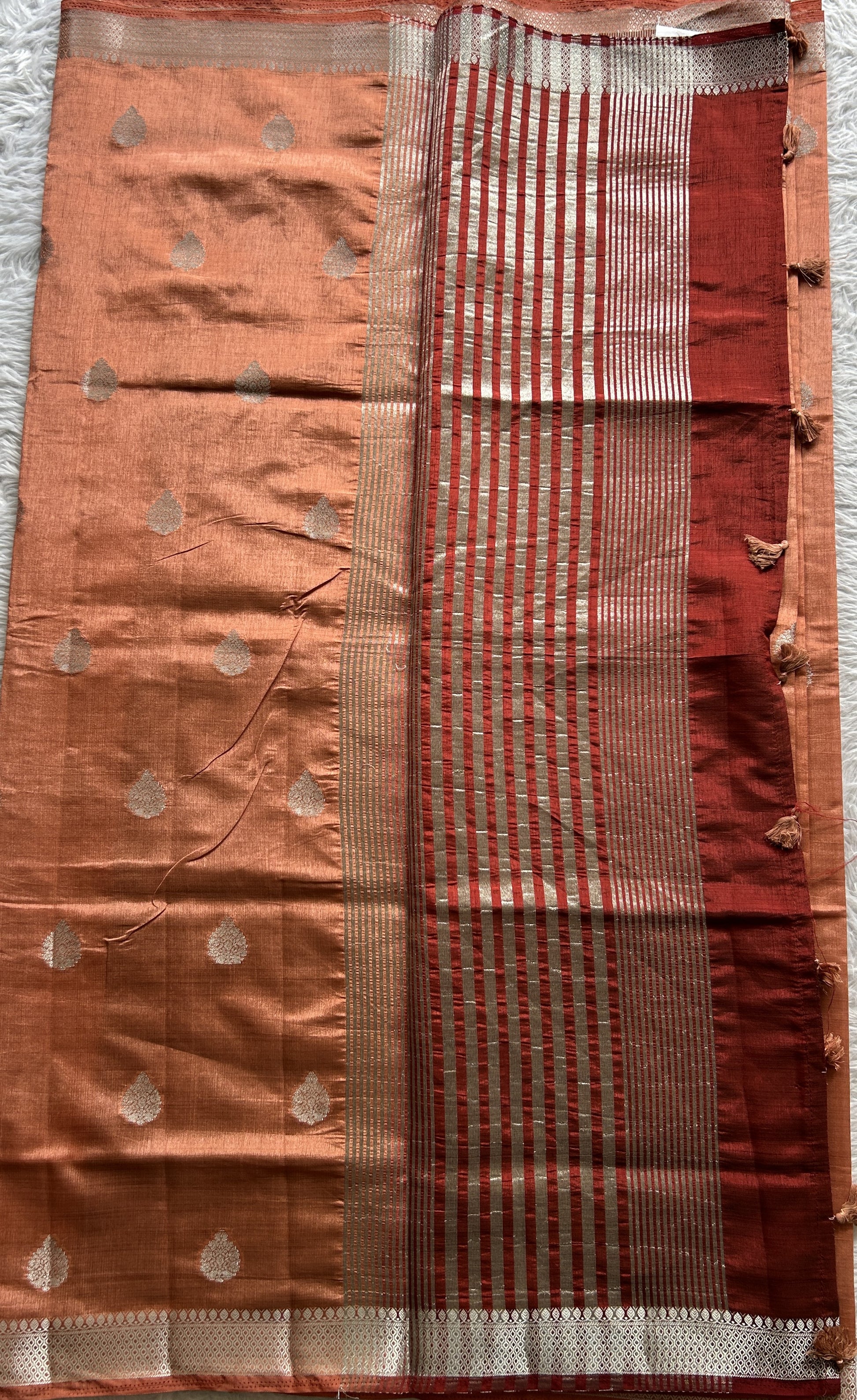 Semi Tussar Saree Peach Colored complemented with a Zari Border. - Sampradaya Designer Studio