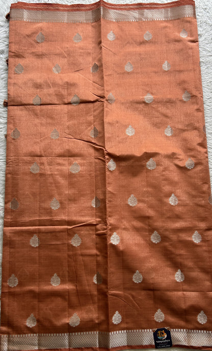 Semi Tussar Saree Peach Colored complemented with a Zari Border. - Sampradaya Designer Studio