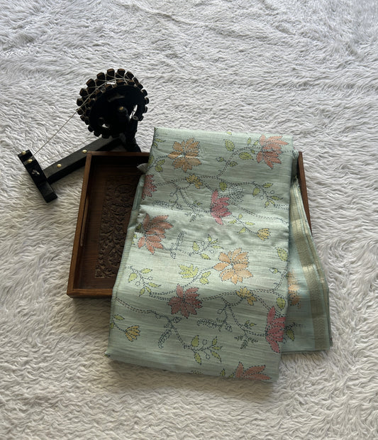 Semi Tussar Saree Colored Grayish Blue Complemented with a Zari Border. - Sampradaya Designer Studio