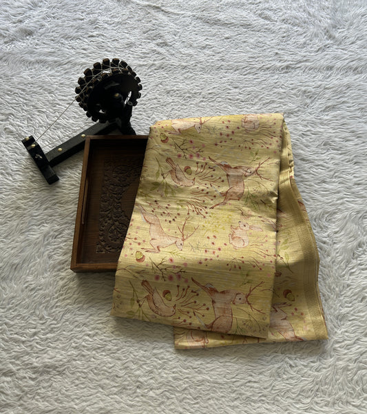 Semi Tussar Saree Colored Light Yellow Complemented with a Zari Border. - Sampradaya Designer Studio