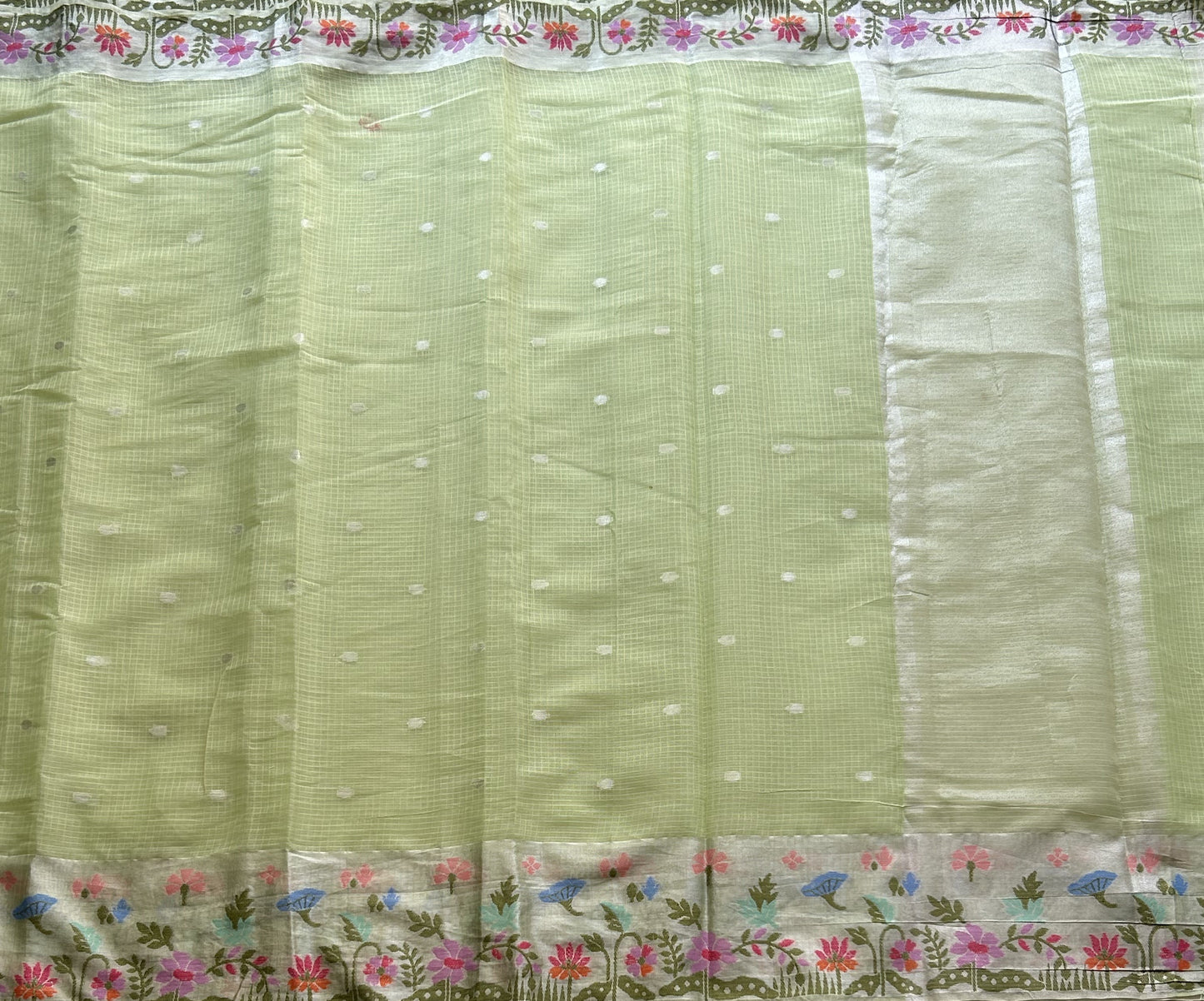 Silk Kota Saree Light Pista Green Colored Elegantly Paired with a Tissue Border