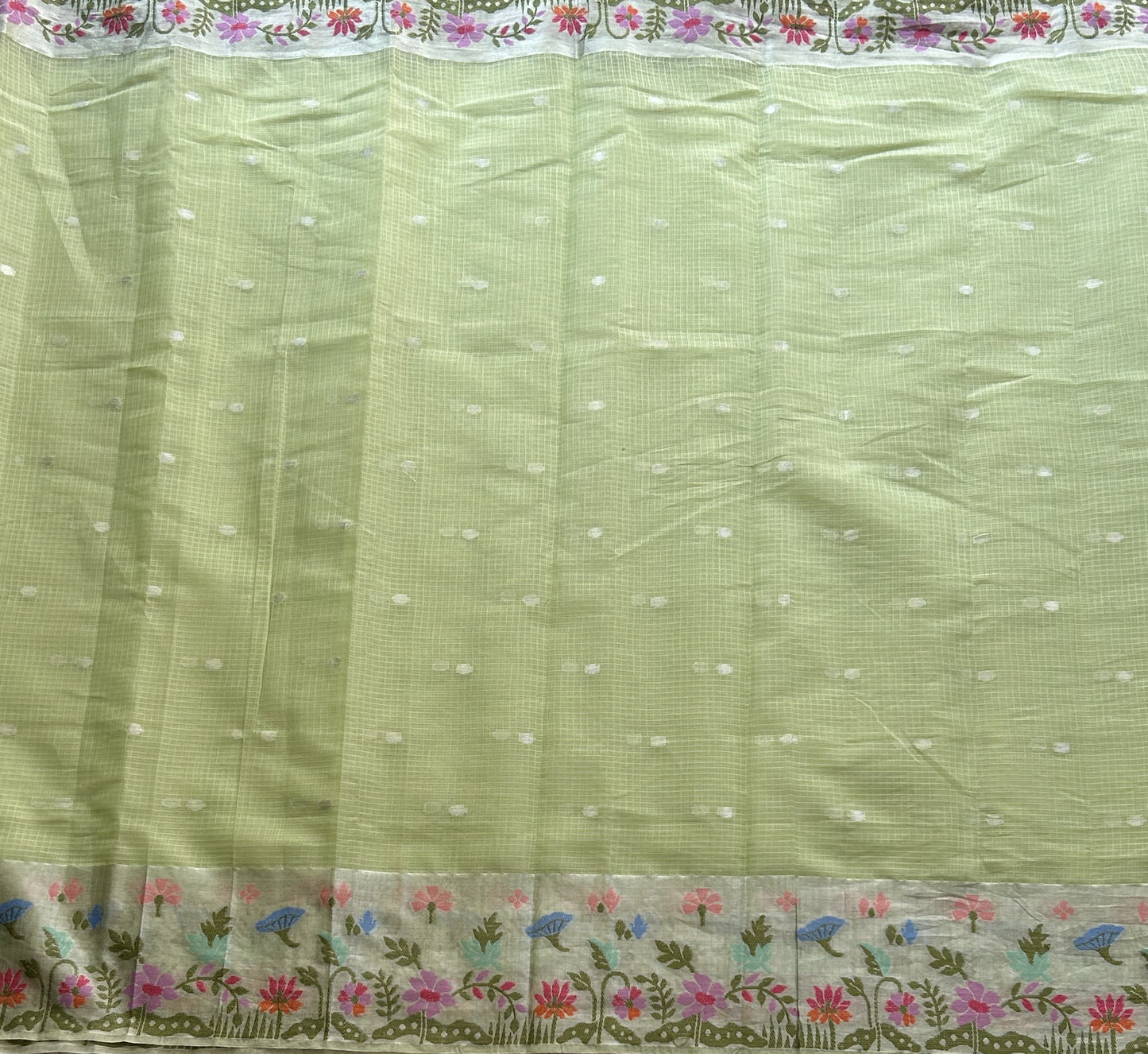 Silk Kota Saree Light Pista Green Colored Elegantly Paired with a Tissue Border