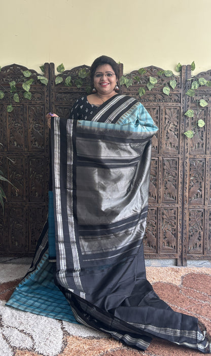 Gadwal Silk Saree Sea Blue Colored Complemented With a Black Zari Gap Border - Sampradaya Designer Studio